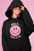 Introducing the ultimate mood booster in fabric form: the "Smile…Pass It On" Happy Face Hoodie! This isn't just any ordinary hoodie; it's a wearable ray of sunshine, guaranteed to spread joy, high-fives, and possibly even spontaneous dance-offs wherever you go.